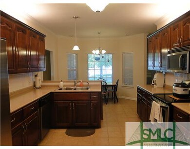Kitchen. Look at this gorgeous kitchen with upgraded cabinets and the open view to the breakfast area.