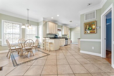 Kitchen featuring ornamental molding, a kitchen ba