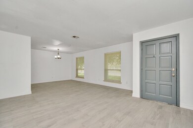 A view of the entryway looking into the formal living and dining.