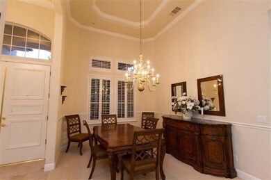 Classic dining room featuring chair rail, crown mo