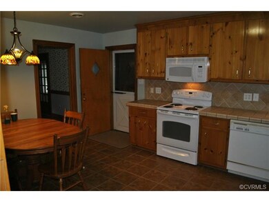 Eat-in kitchen has side entry to garage
