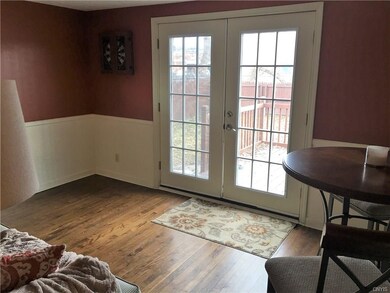 Separate den with French doors out to the deck.