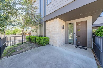 View of exterior entry with a patio area
