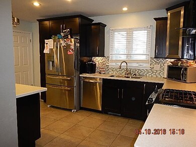 LOTS OF RECESSED LIGHTING IN THIS KITCHEN