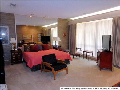 Huge master bedroom with view of backyard.