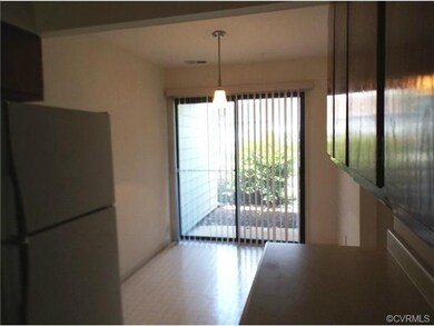 Kitchen dinette area and sliding door to small fro