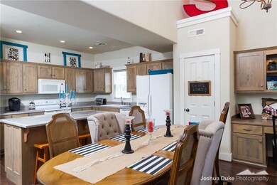 This open layout of the kitchen/dining/living is a family favorite!