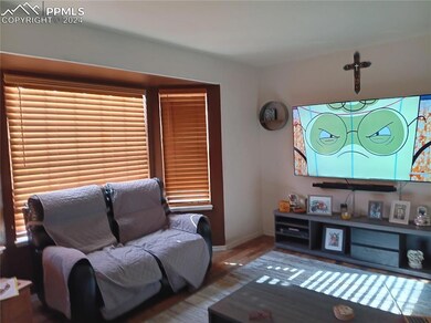 Living room with dark hardwood / wood-style floori