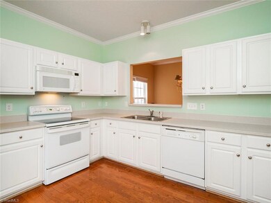 Kitchen with great cabinet and counter space! Pass through to dining room.