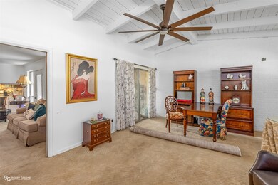 Dining area with carpet, a ceiling fan, wooden ceiling, and plenty of natural light
