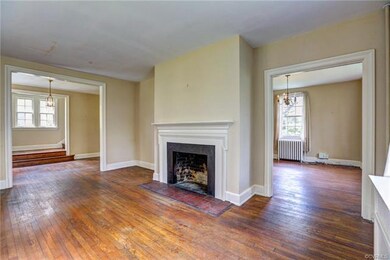Views from the living room into the foyer to the left and dining room to the right.