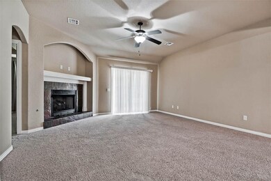 Wired for surround sound, blinds, cozy gas log fireplace, ceiling fans throughout, brand new carpet, sliding doors to huge patio.