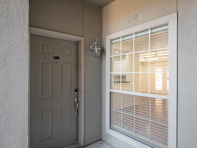 View of exterior entry featuring stucco siding