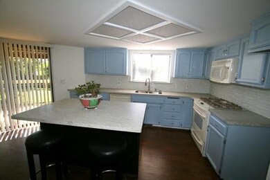 Island Kitchen w/ slab granite counters