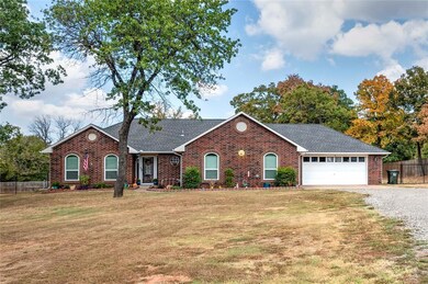 Single story home with a front lawn and a garage
