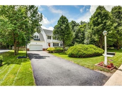 Home sits back on a large lot with both mature and