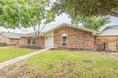 Single story home featuring a front lawn