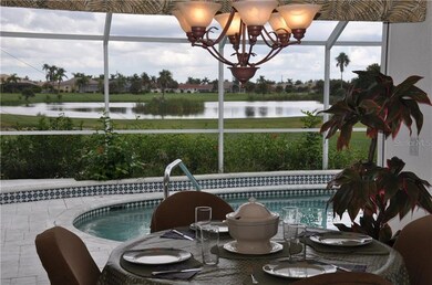 View of lanai, pool, golf course and lake from the