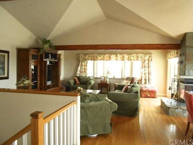 Open family and entertainment room with fireplace 