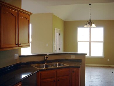 Beautiful kitchen with snack bar open to breakfast