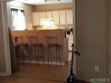 VIEW OF KITCHEN FROM THE LIVING ROOM