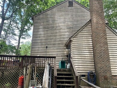View of side of property featuring a deck