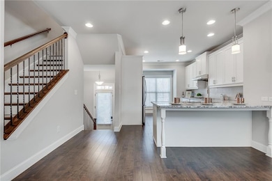 Kitchen with White Cabinets, Light Granite Stone C