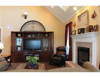 Family Room. A fireplace, vaulted ceilings, recess