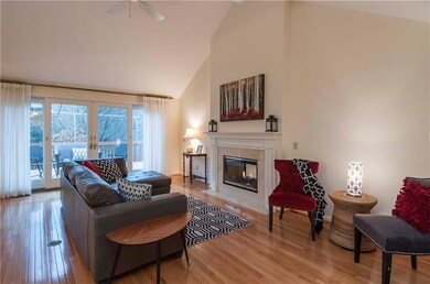 Living room with soaring ceilings and two-sided fi