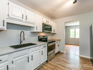 New Floors, Counters, Appliances, Sink, Fixtures, and Lighting