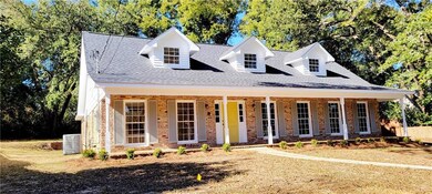 Cape cod-style house with covered porch and centra
