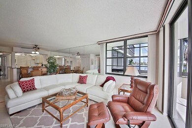Living area featuring a textured ceiling and ceiling fan