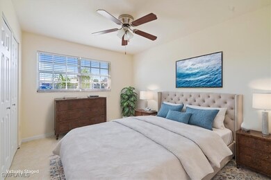 Bedroom featuring ceiling fan and a closet