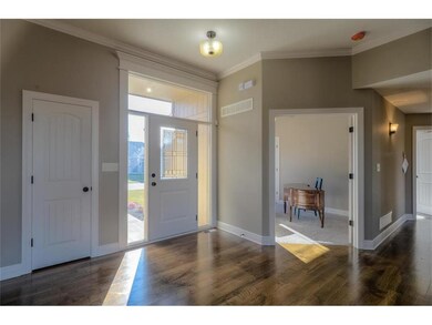 Front foyer of the home.  Coat closet located next