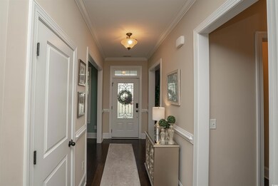 Doorway to outside with baseboards, ornamental mol