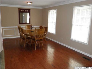 Chairrail and crown molding add to the attractiven