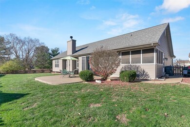Large aggragate patio with sidewalk to front