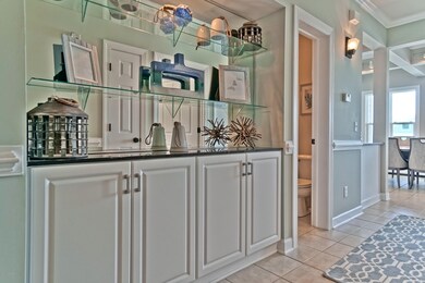 Extra cabinet storage in hall built-ins.