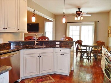 Kitchen. Custom cabinets with mocha glaze, granite