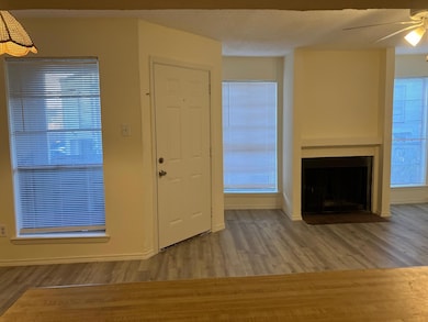Entrance foyer featuring ceiling fan, hardwood / w