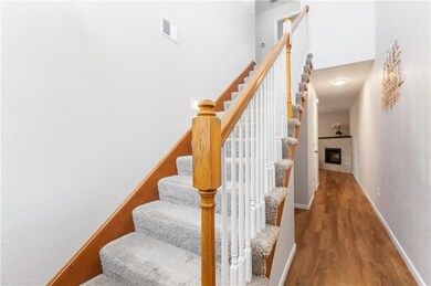 Stairway with hardwood / wood-style floors