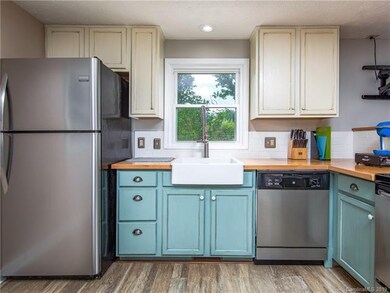 Kitchen attractively updated with new flooring, st