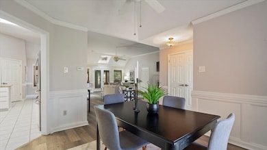 Dining space featuring ornamental molding, ceiling