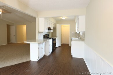 Full view of kitchen from breakfast nook also look