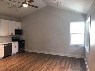 Kitchen with white cabinets, stainless steel appl