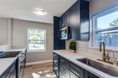 Kitchen featuring appliances with stainless steel 