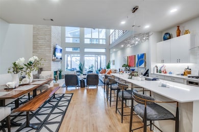 Kitchen with light countertops, a kitchen breakfas
