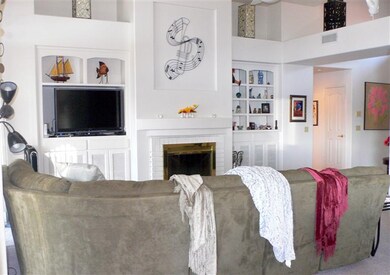 Great room, fireplace, entertainment center, ceili