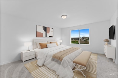 Bedroom featuring carpet flooring and baseboards