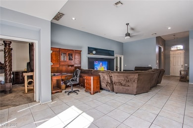 Living room with recessed lighting, visible vents,